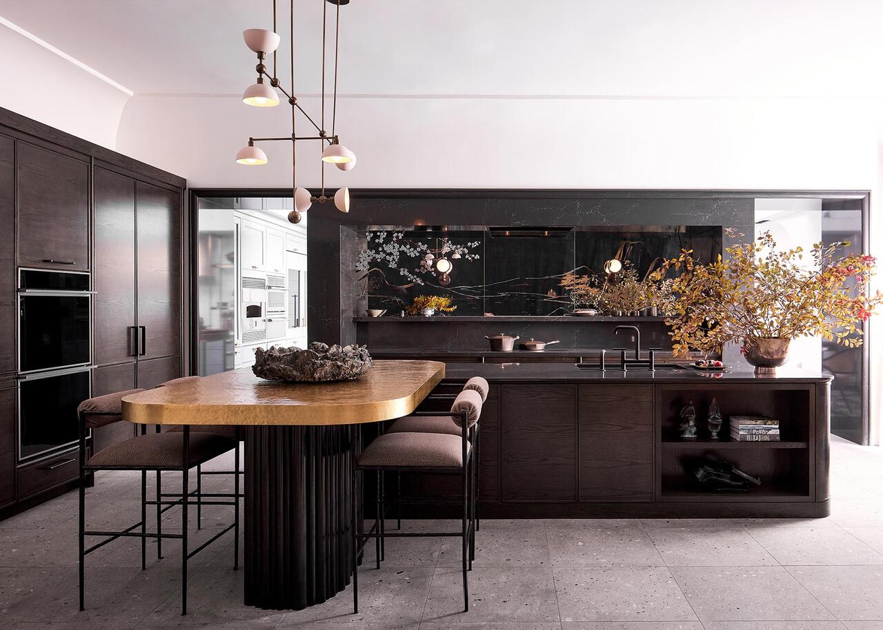 dark wood kitchen with gold accents