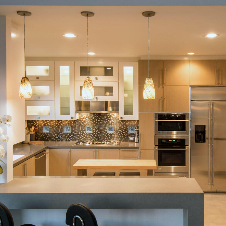 g shaped kitchen with modern lighting